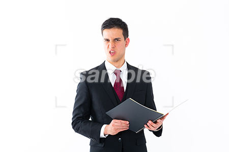 男性がノートを持って嫌な顔をしている a0011237PH