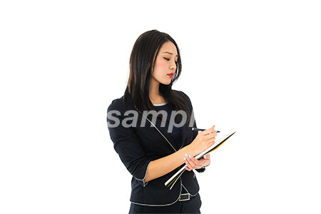 切り抜き。筆記しながらノートをみている女性、目線無し（PSD形式/切抜マスク付き） cta0040243PH
